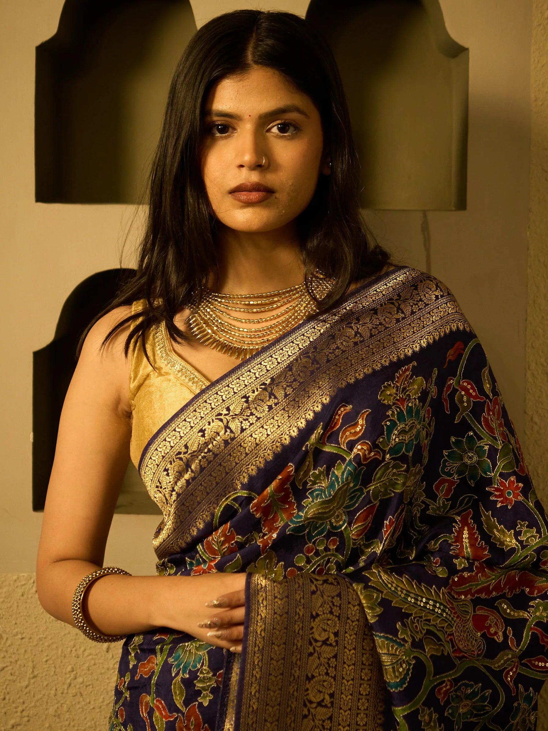 Blue soft silk Kalamkari saree with Jamawar pattern and broad gold Zardozi border, draped on model, full front view